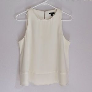 Ann Taylor petite medium winter white sleeveless flared blouse.